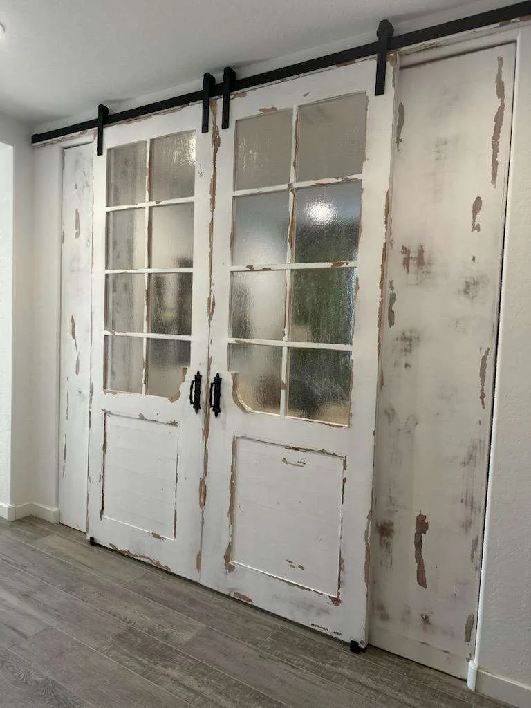 Distressed French Lite barn door set with raised panel base