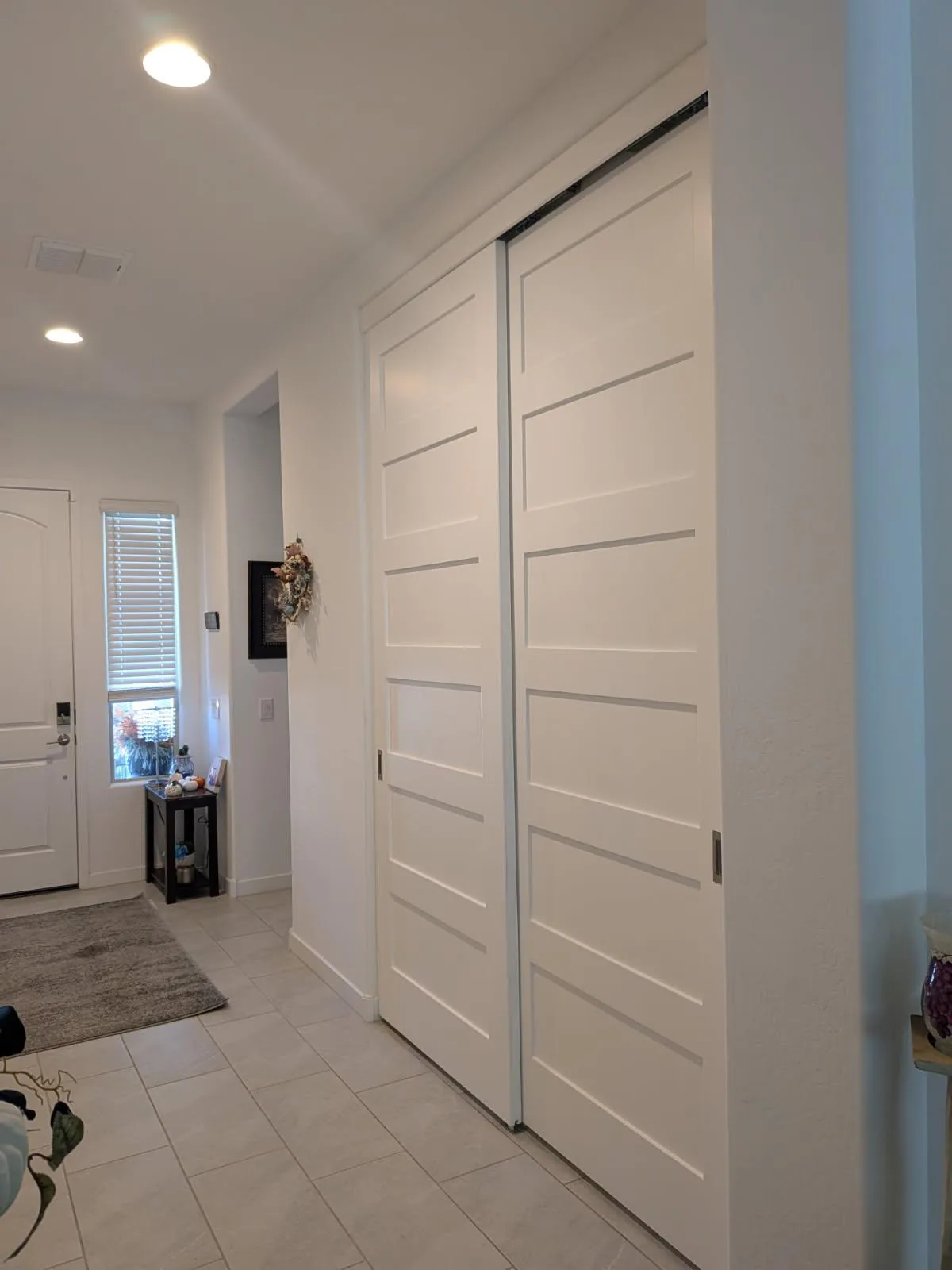 Five Panel Shaker Bypass barn doors on a compact track