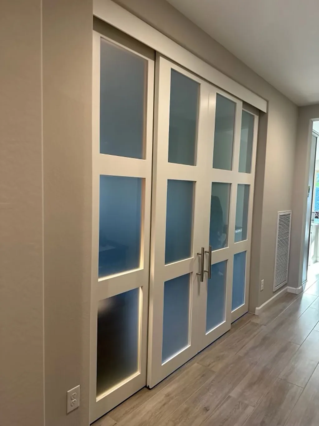 Four Door Twelve-Lite Frosted Glass barn door system with hidden track