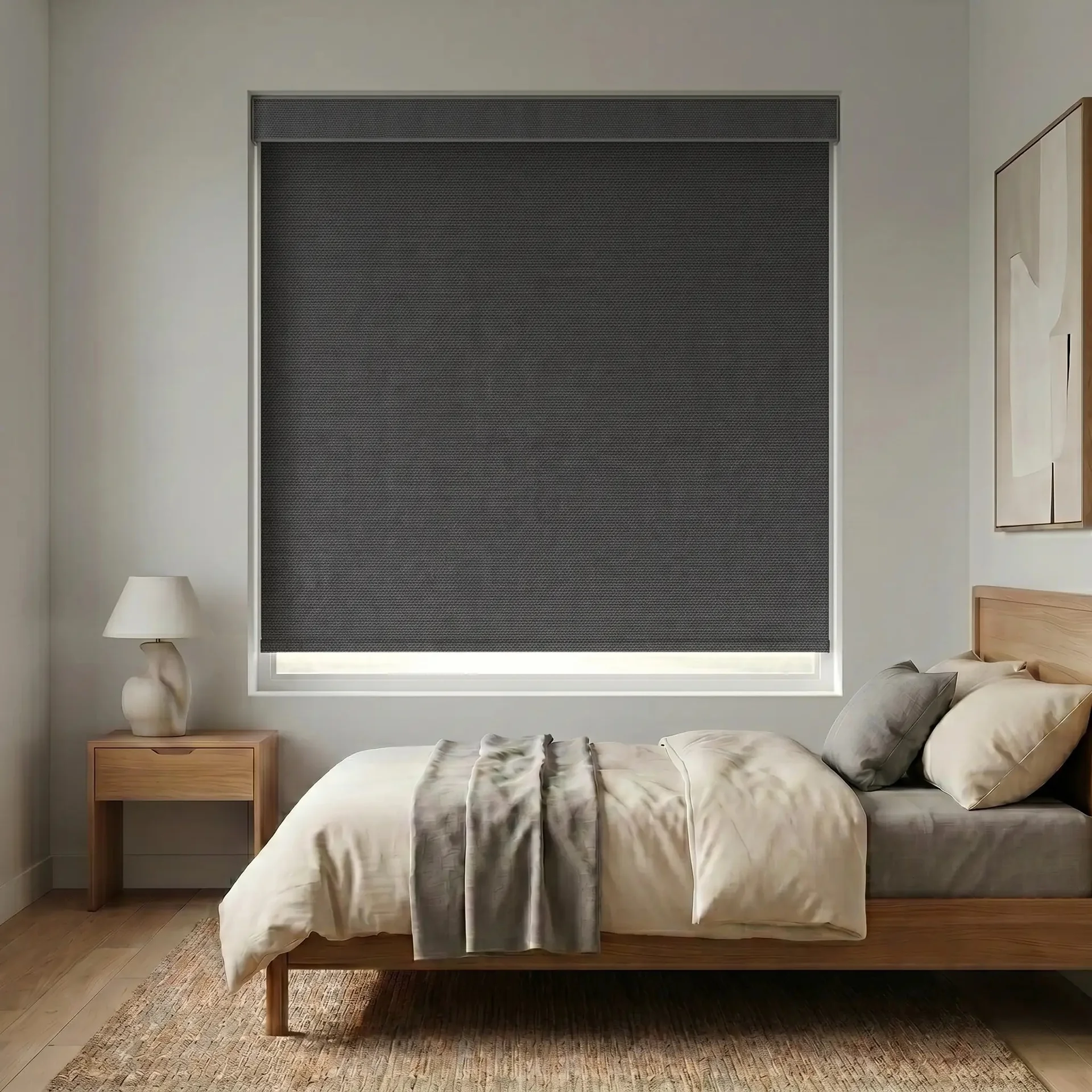 Graphite blackout roller shade with cassette valance in a bedroom
