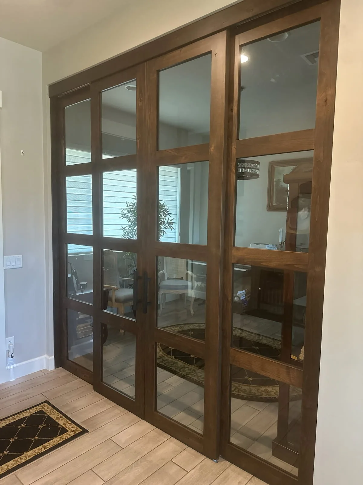 Large Eight-Lite Clear Glass barn door set in stained wood