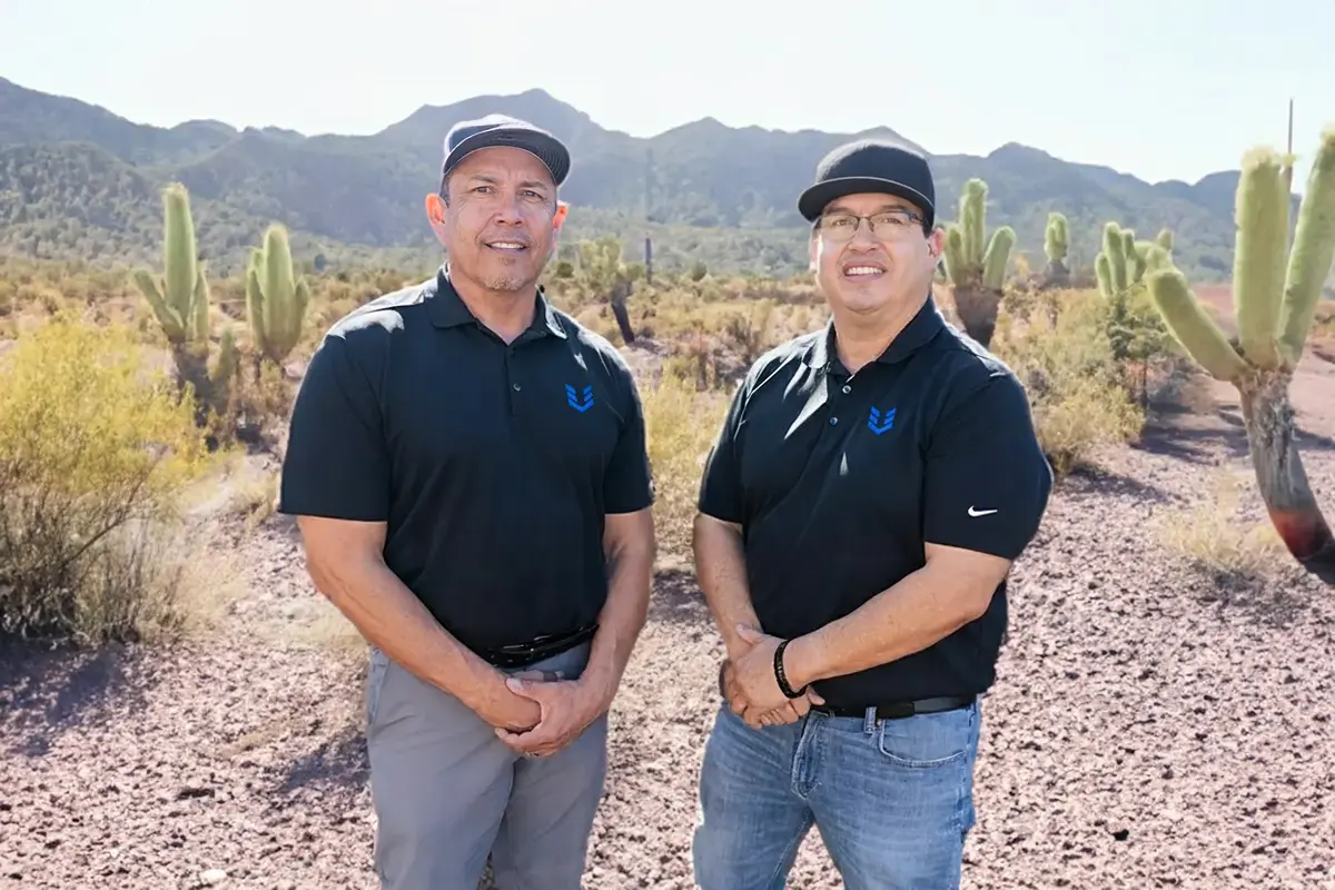 Phil Garcia and Hector Aguilar, owners of VIP Shutters, in the Arizona desert