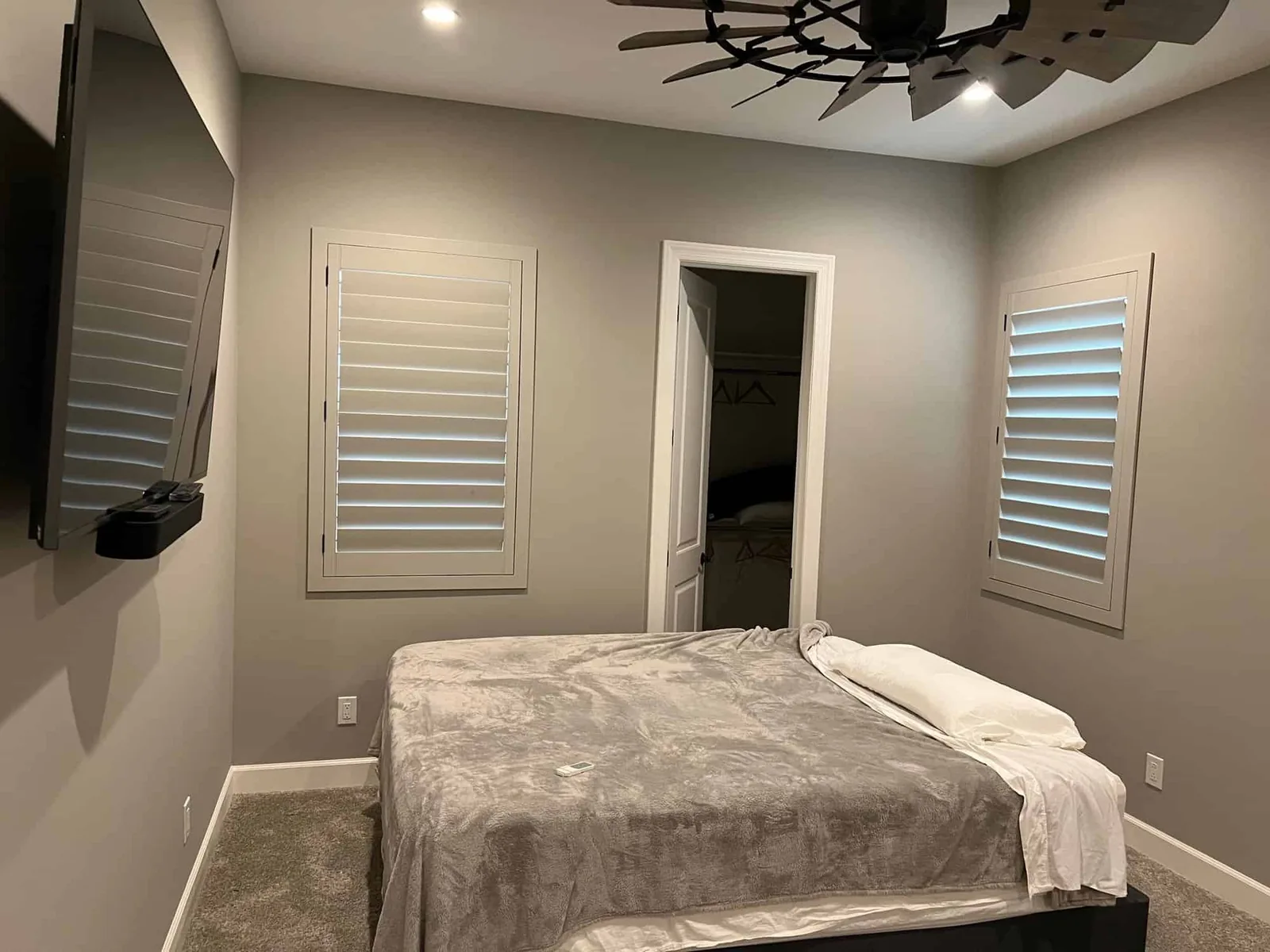 Plantation shutters on two corner bedroom windows