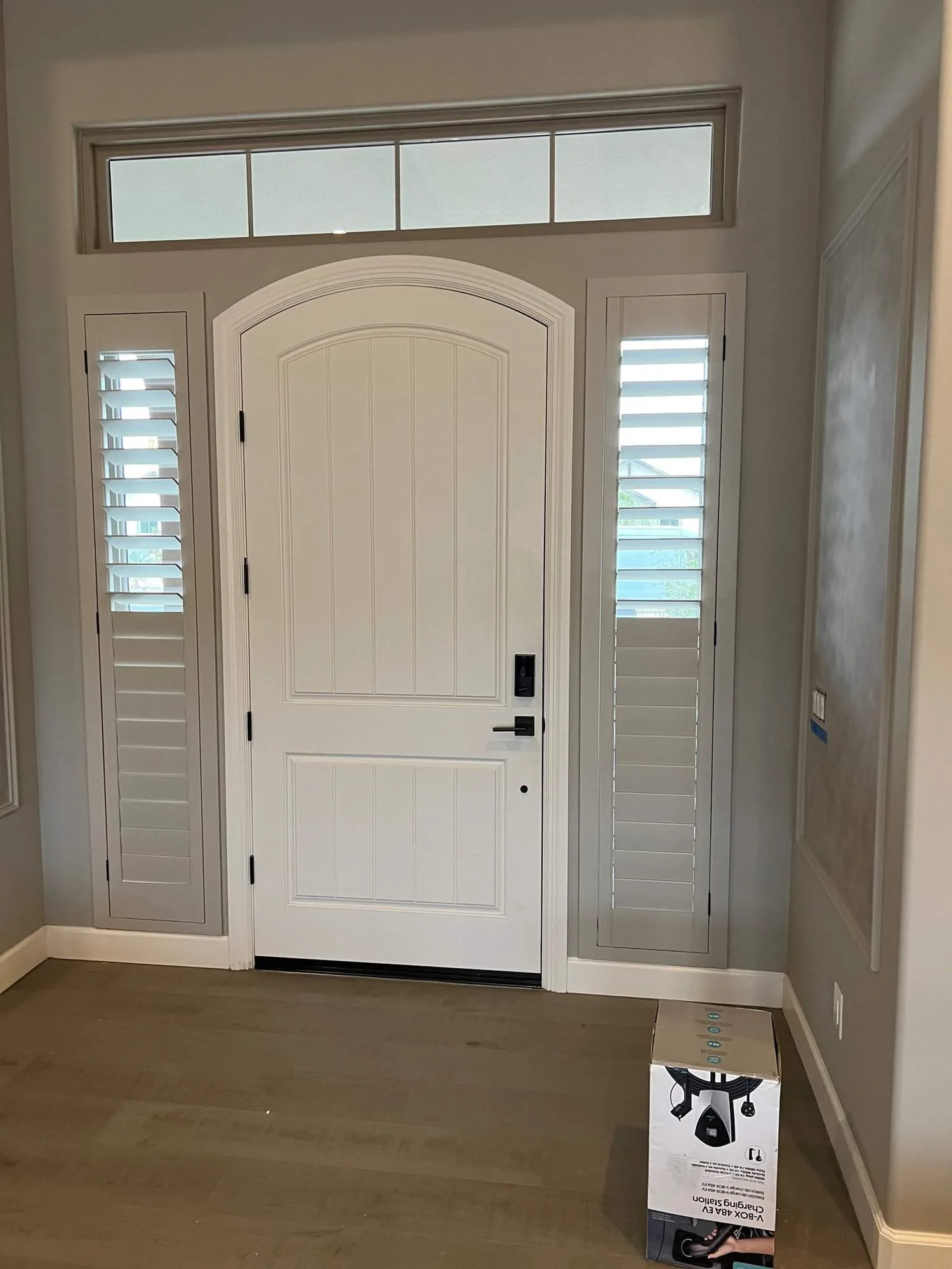 Plantation shutters on entry door sidelights