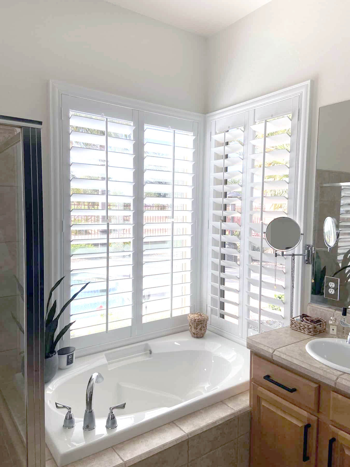 Polywood shutters on a bathroom corner window