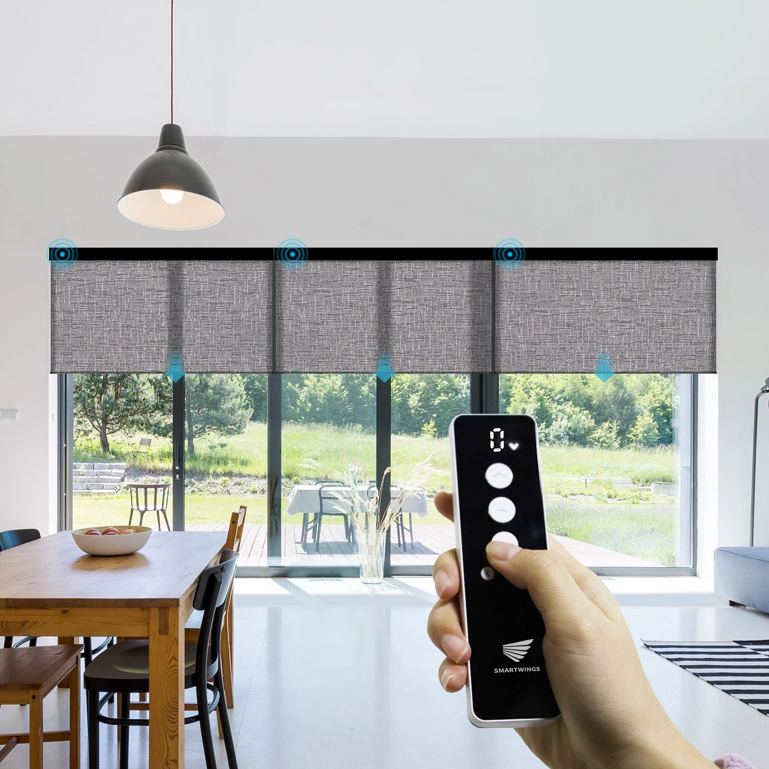 Remote-controlled motorized roller shades on a patio door