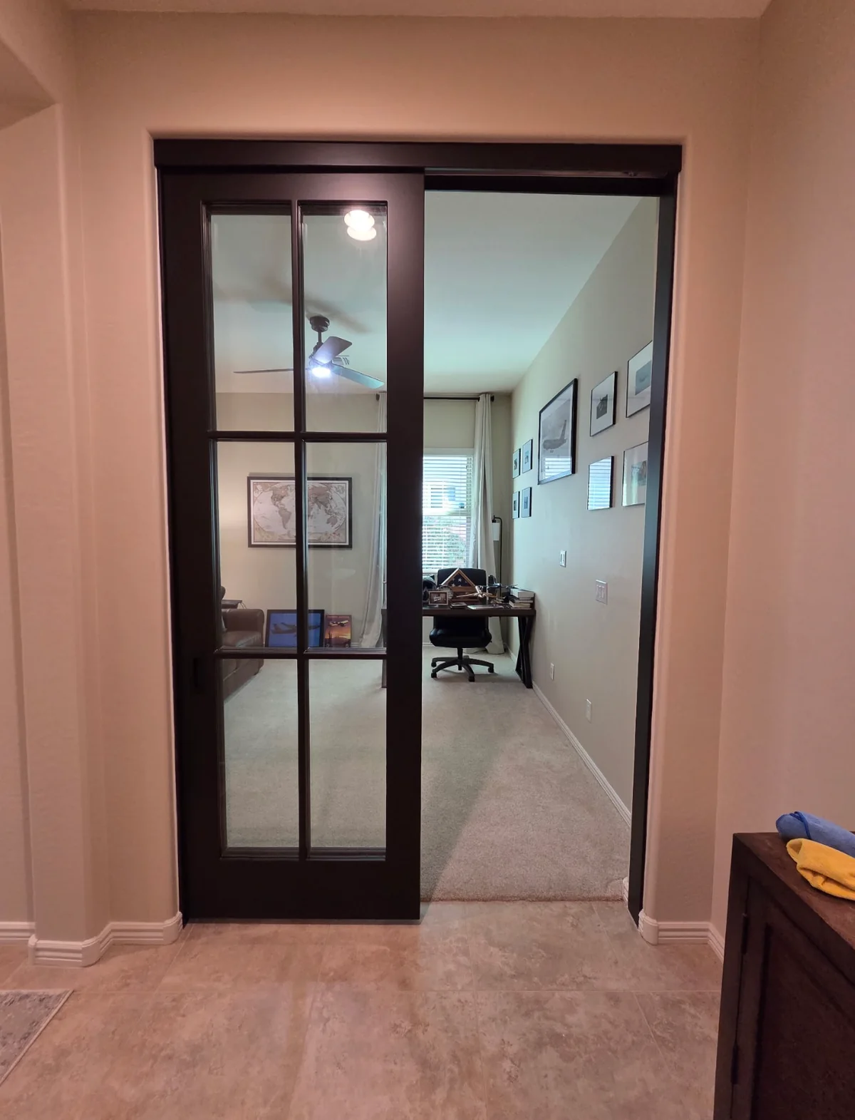 Six-Lite Bypass Glass barn doors, espresso stained, slid open to a home office