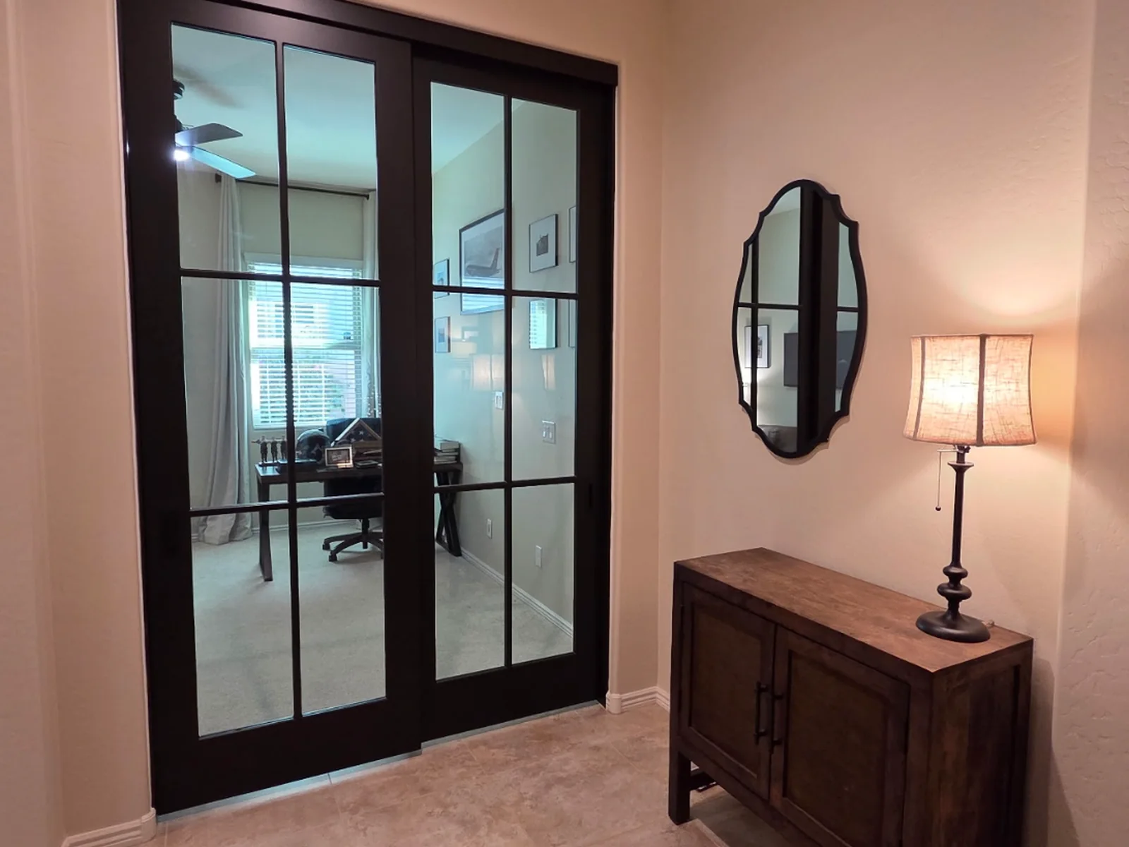Six-Lite Bypass Glass barn doors, espresso stained, closed across a home office entry